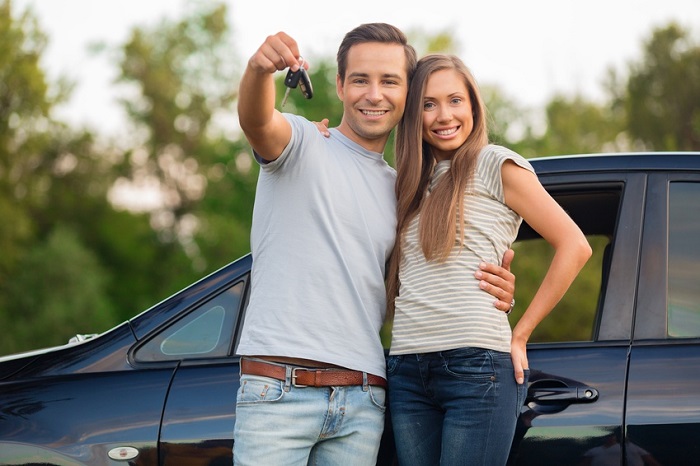 Couple holding car keys